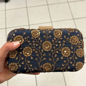 Blue embroidered clutch